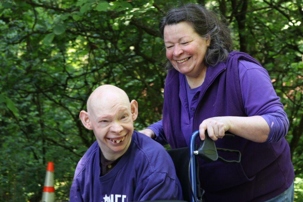 Older woman with adult disabled son in a wheelchair