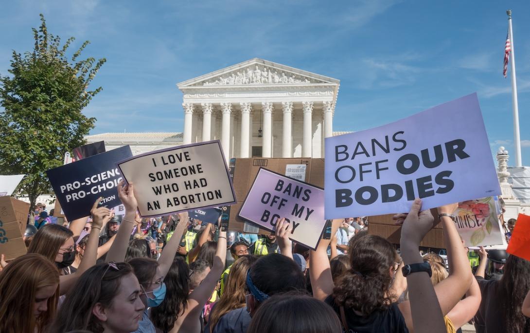 Woman hold pro-choice signs in protest at nation's capital.